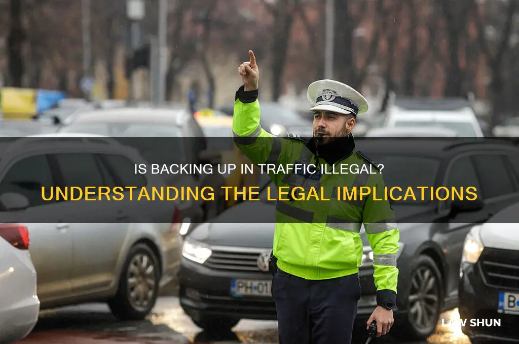 is it against the law to back up in traffic