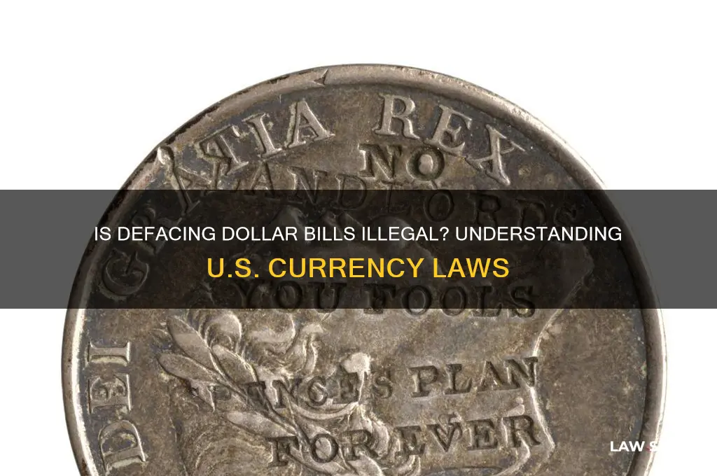 is it against the law to deface a dollar bill