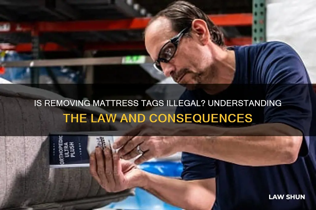 is it against the law to take tags off mattress