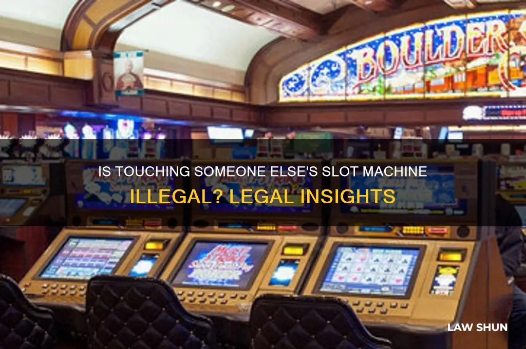 is it against the law to touch someone slot machine