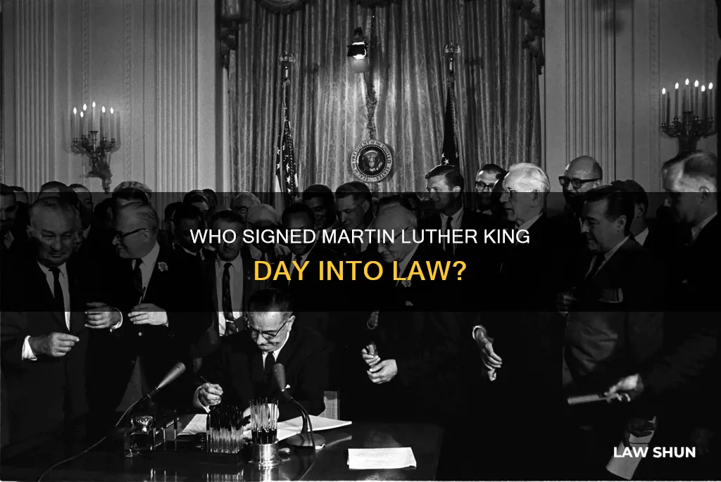 what president signed the law creating msrtin luther king day