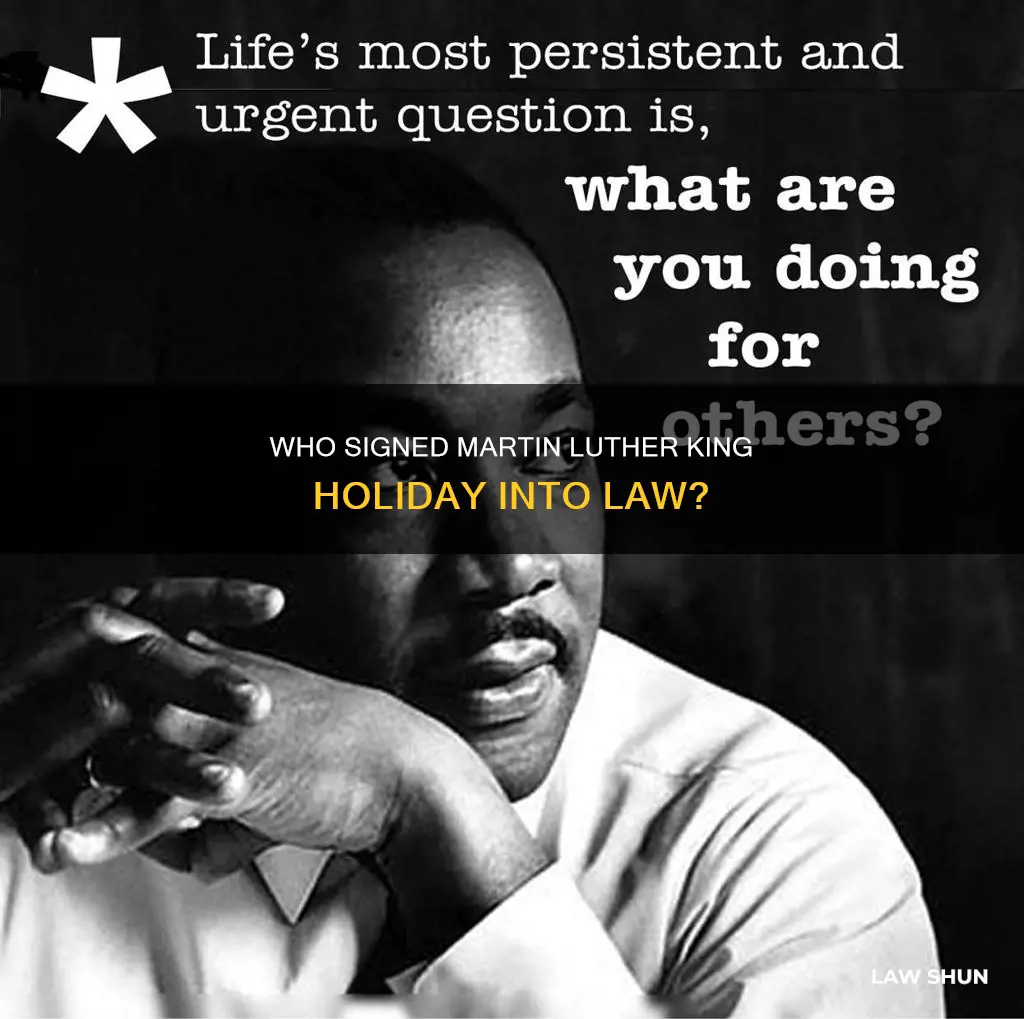 which president signed the law creating martin luther king holiday