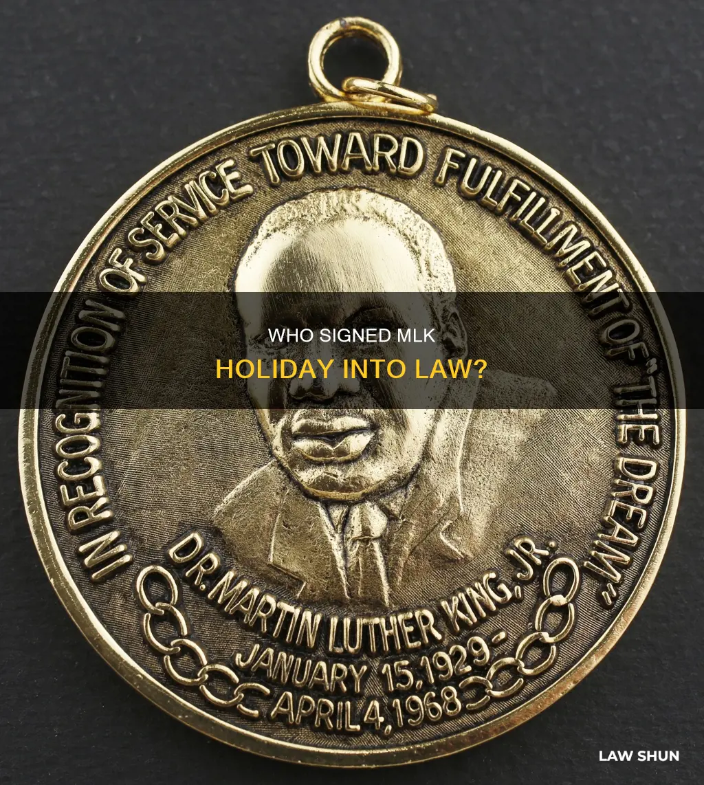 which president signed the law creating mlk holiday
